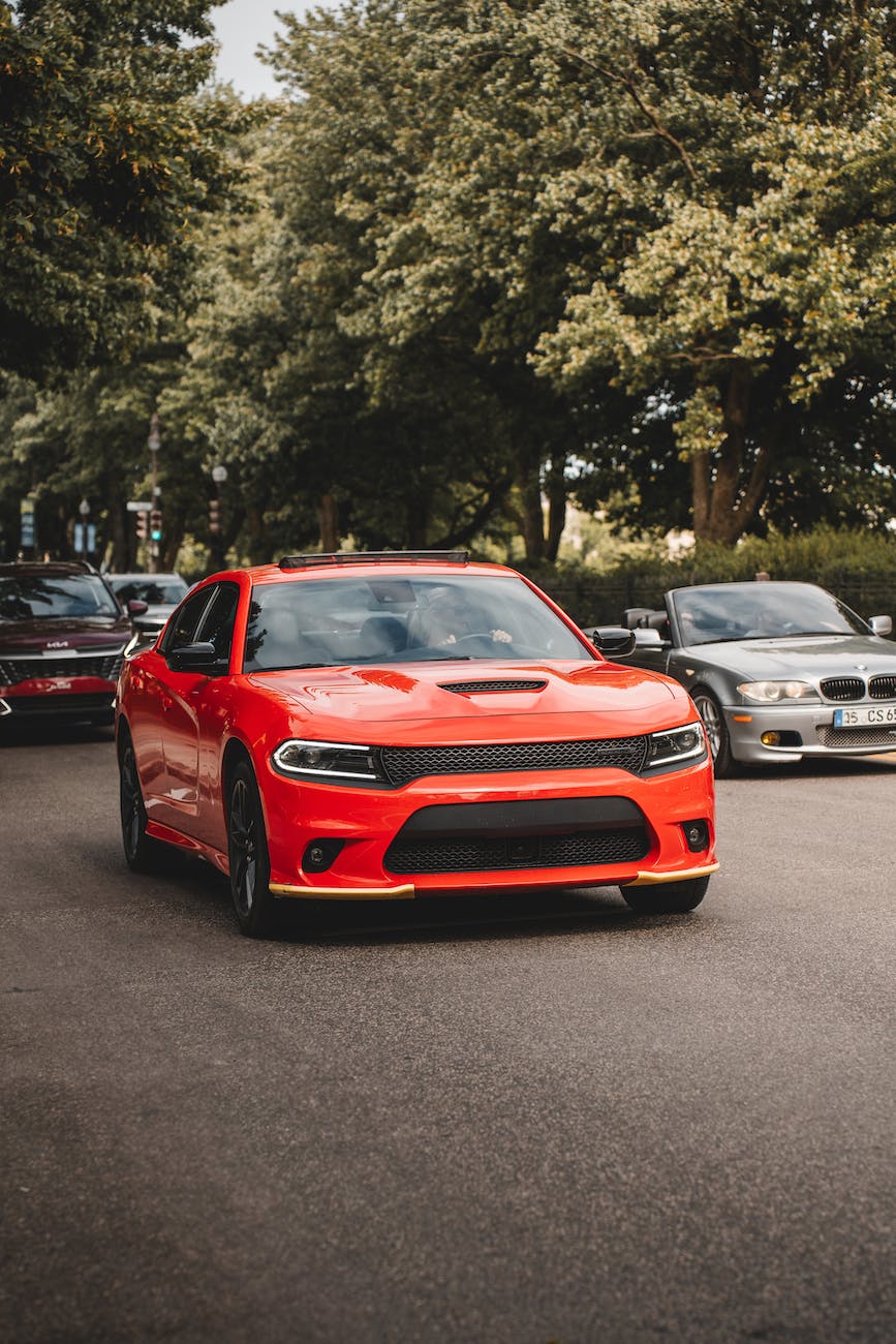 red dodge charger on street